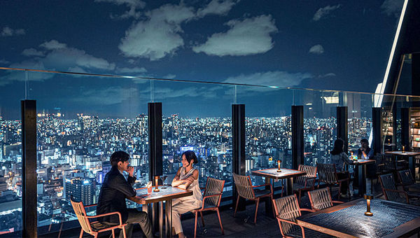 Centara Grand Hotel Osaka's rooftop dining offers panoramic views of the city, with F&B options like premium dry-aged steaks, fine whiskeys, smokehouse fare, lounge-style afternoon tea, and signature cocktails.