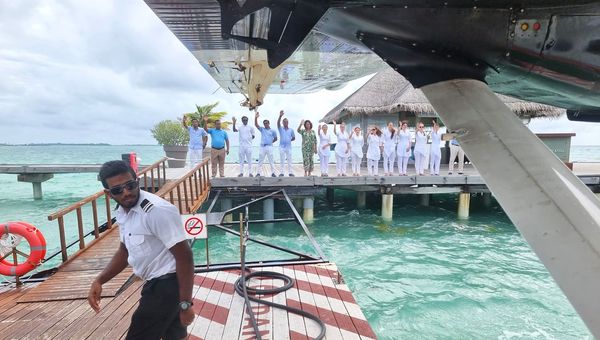 The LUX* South Ari Atoll team waving goodbye as our group boarded the seaplane back for Malé airport.